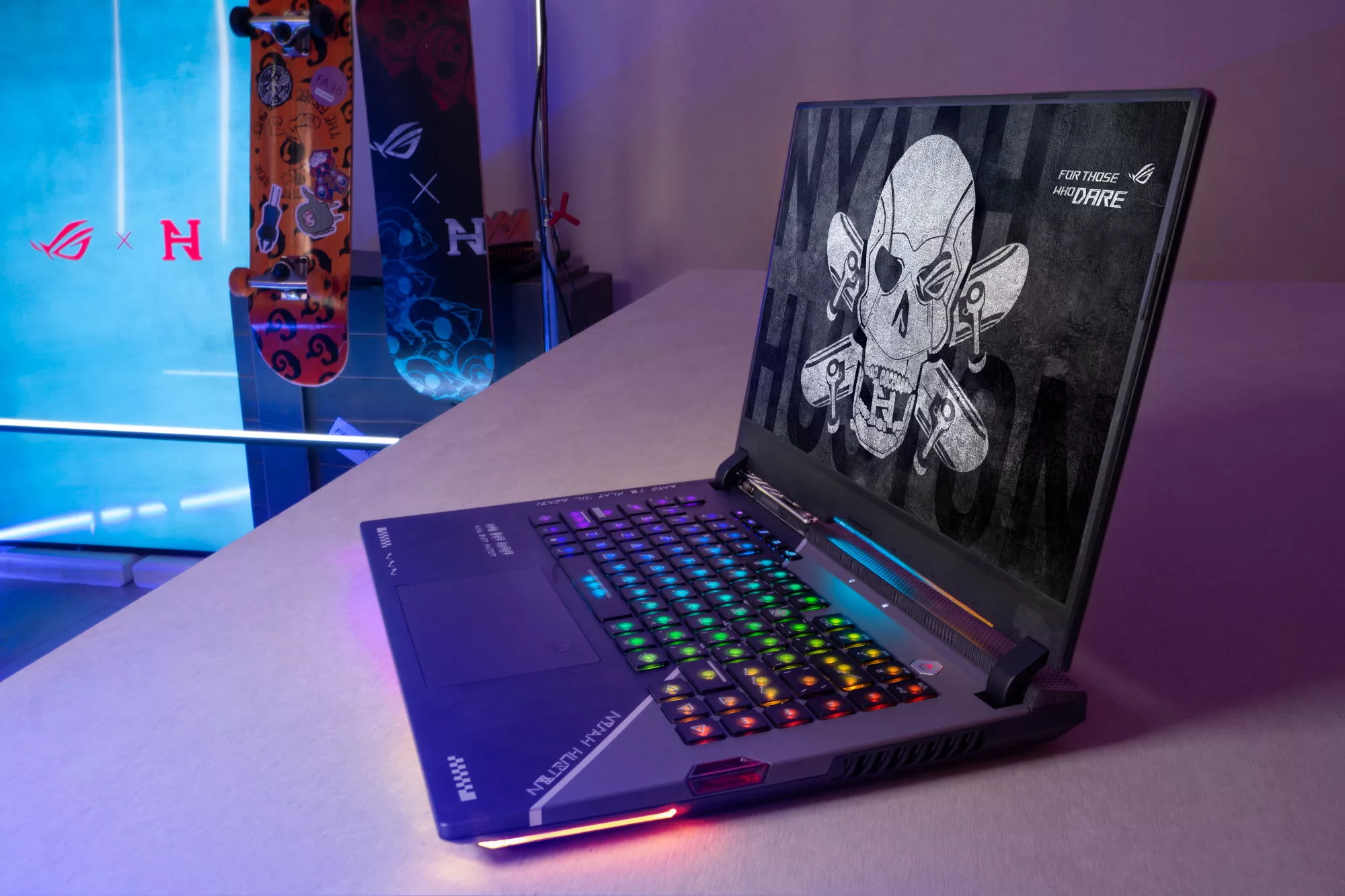 The custom laptop is featured, with emphasis on the custom keyboard deck and accents.