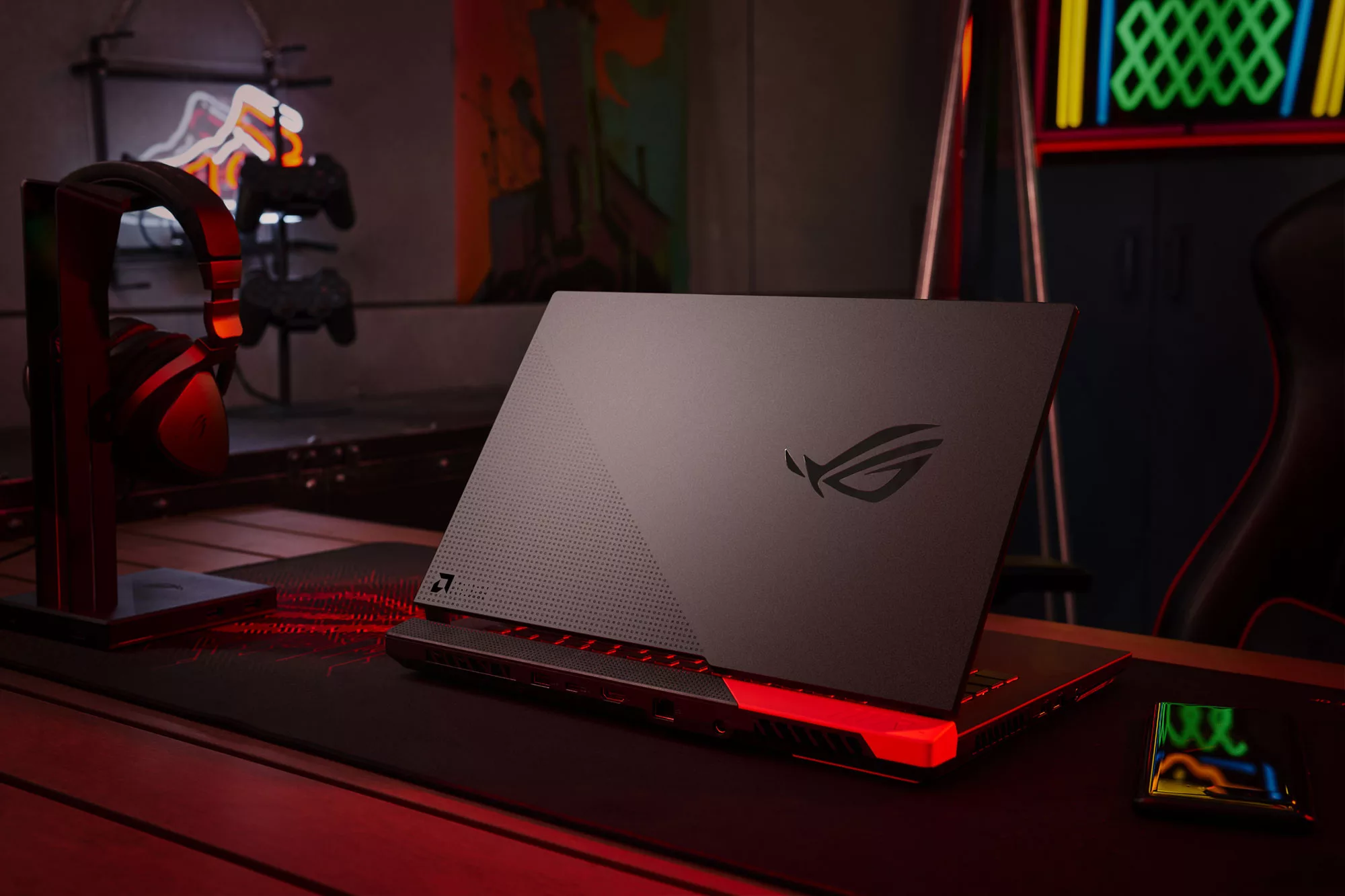 ROG Strix G Advantage Edition, sitting on a table, with the ROG eye logo visible.