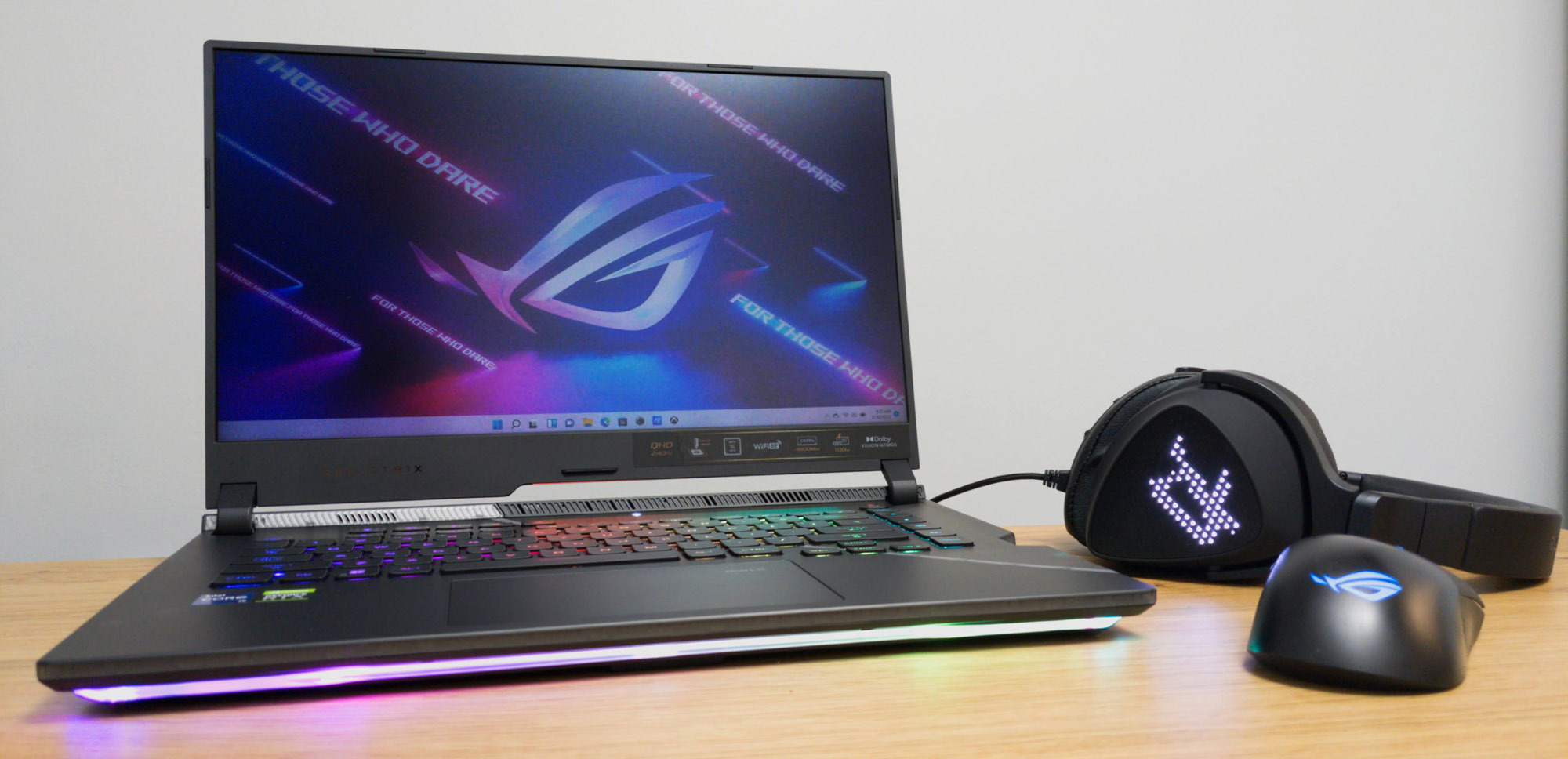 A photo of the 2022 Strix SCAR 15, with a Delta S Animate headset and Keris Wireless mouse.
