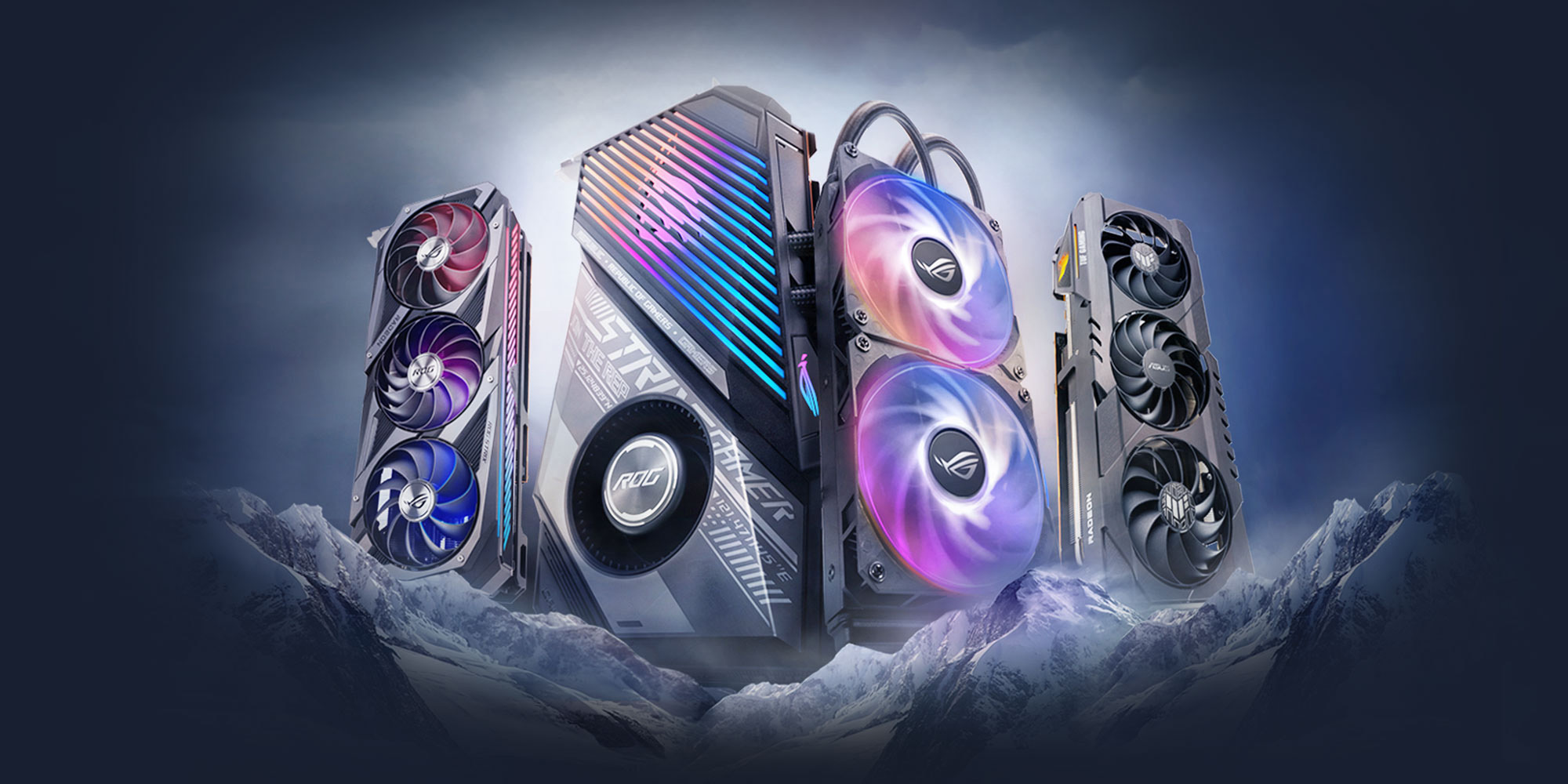 An image showing three ASUS graphics cards atop snowy mountain, with RGB lighting illuminated.
