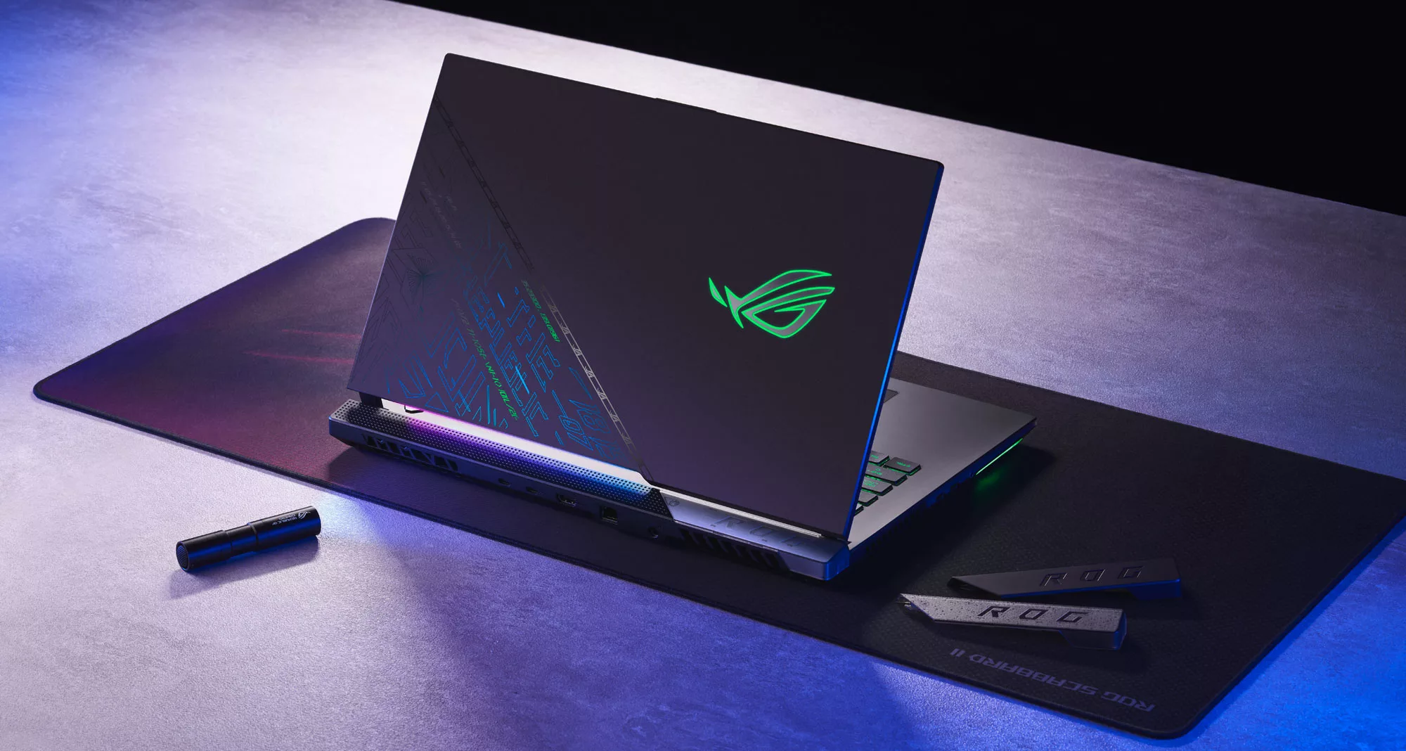 An image of the ROG Strix SCAR 17 SE sitting on a desk mat, with the lid open.