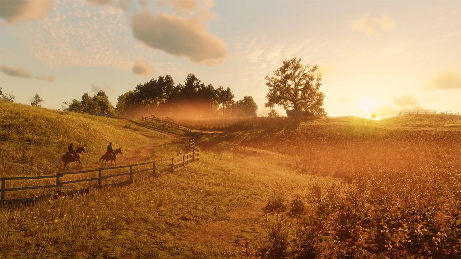 Two character ride horses along a fence line in a field, during the sunset.