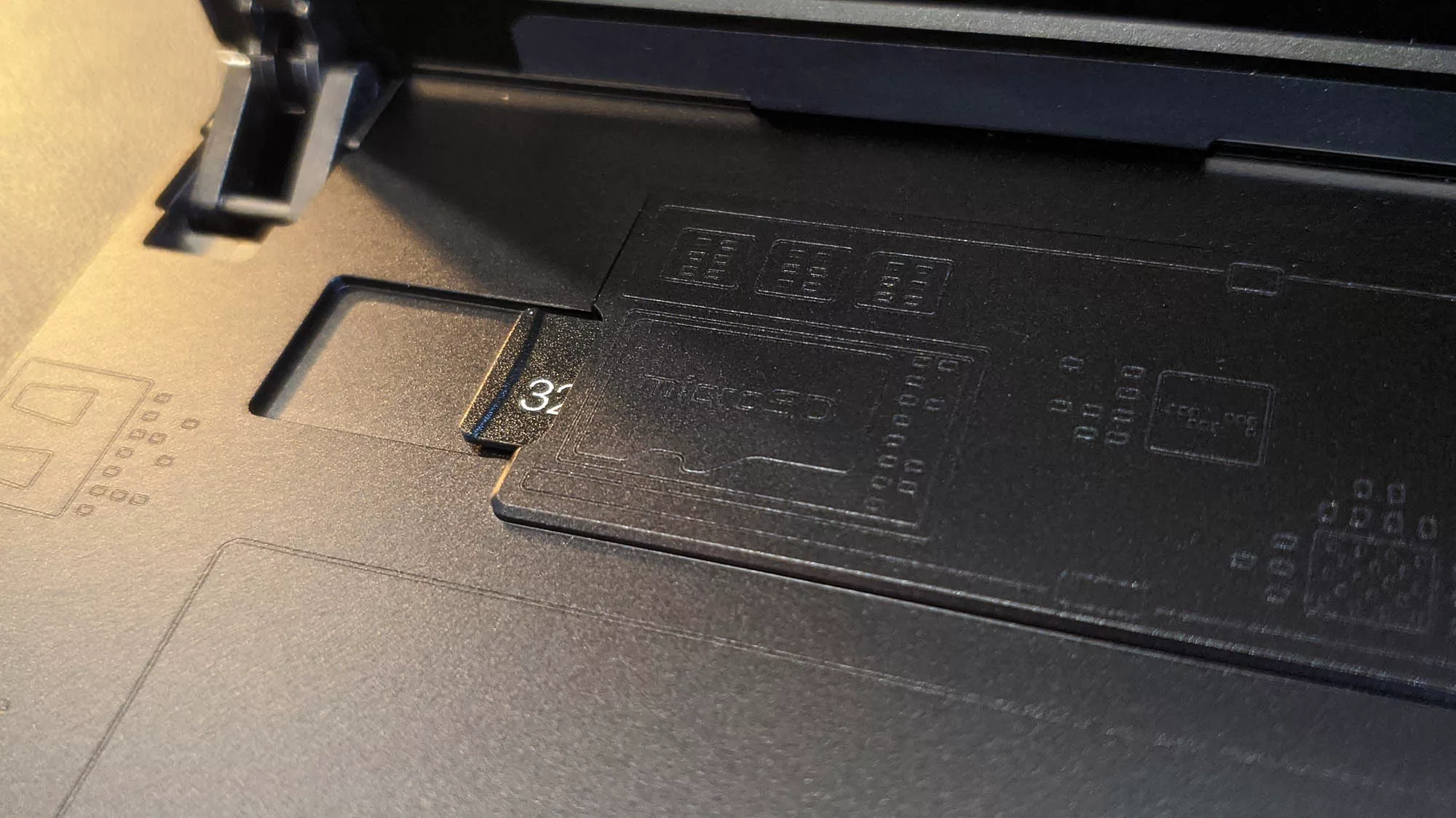 A photo of a microSD card inserted into the Flow Z13 tablet.
