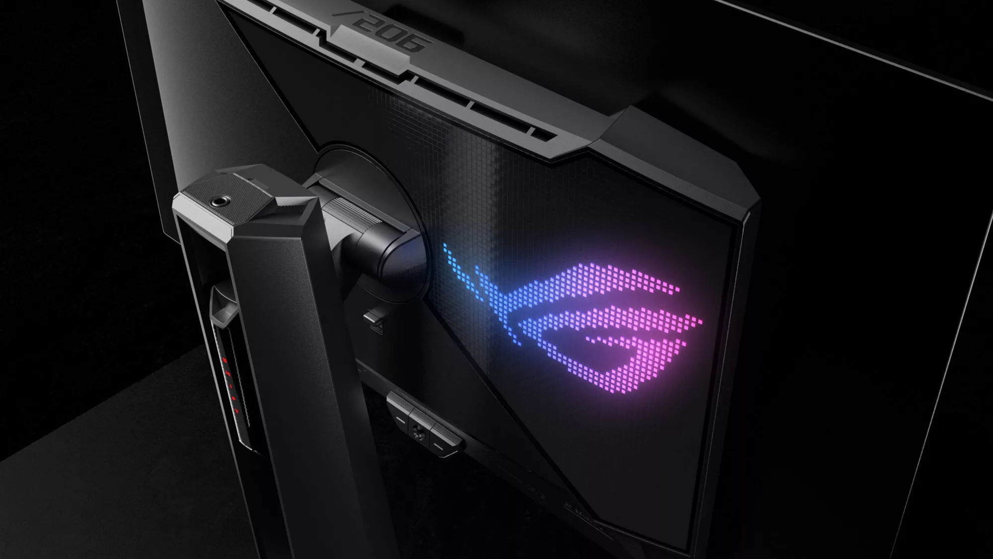 A rear view of the ROG Swift OLED PG27AQDM monitor with the RGB logo illuminated.