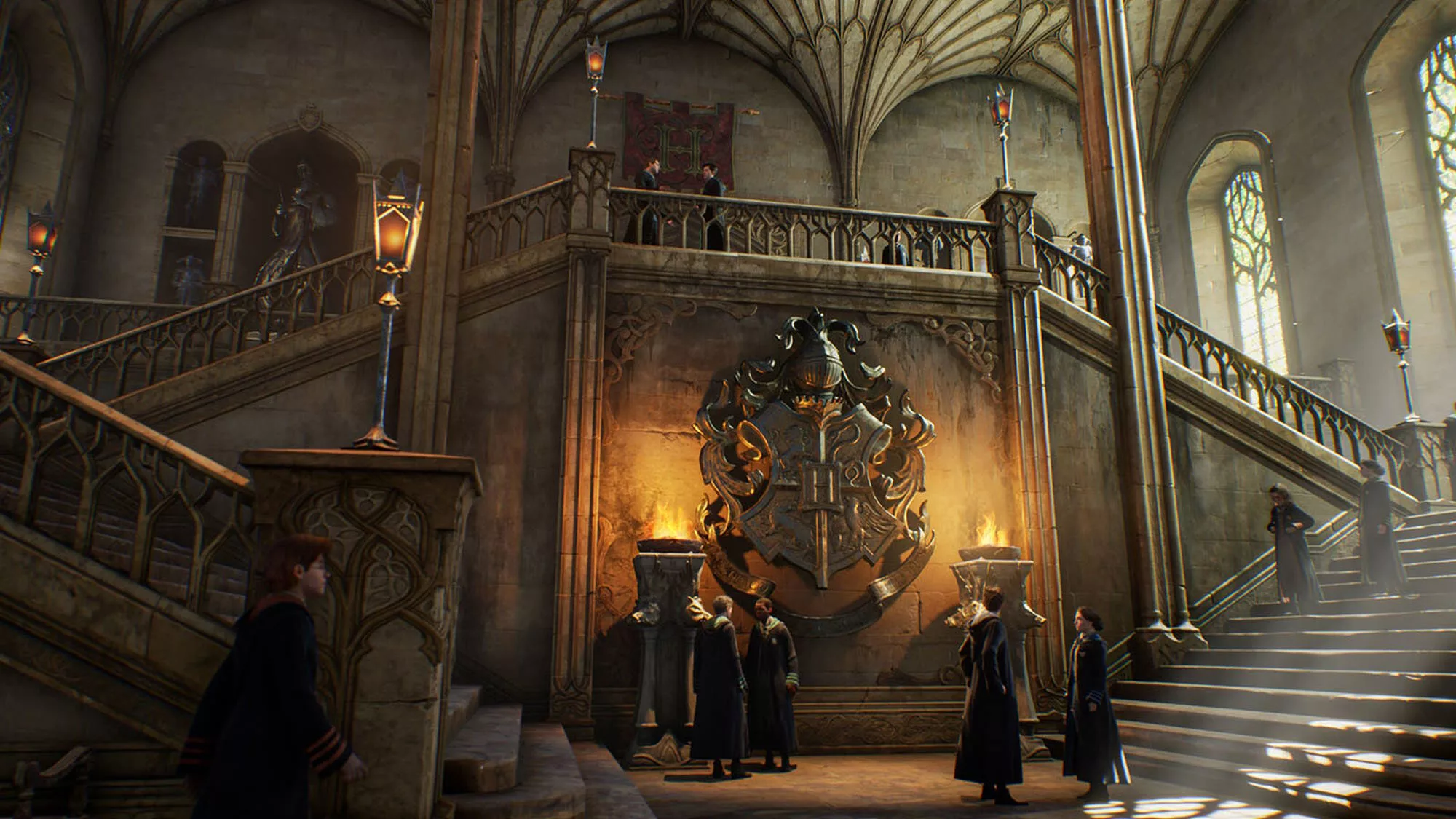 A screenshot of Hogwarts Legacy showing stairs and a crest inside Hogwarts Castle
