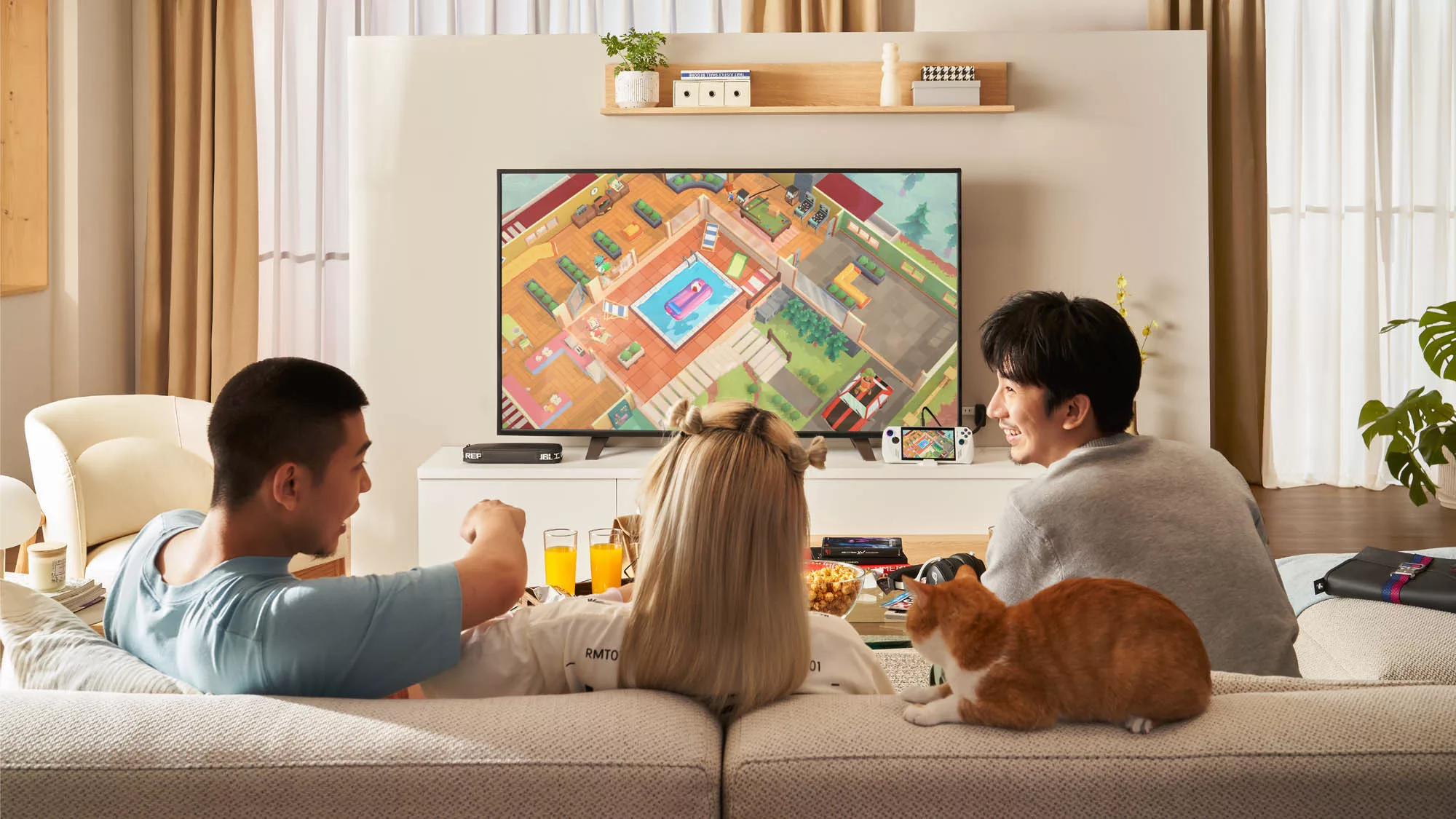 A photo of three people on a couch, playing a game on the TV in front of them.