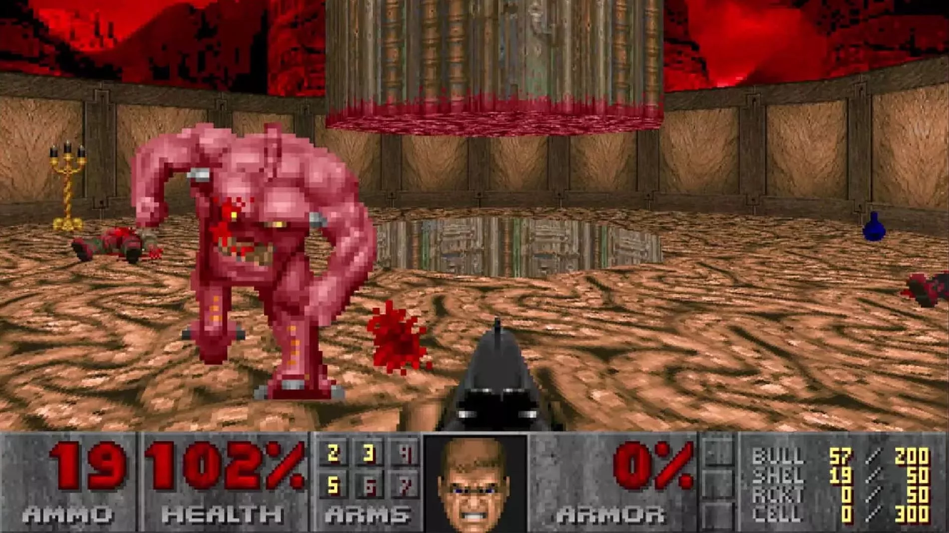 Screenshot of the original Doom, with a first-person shotgun pointed at a demon.