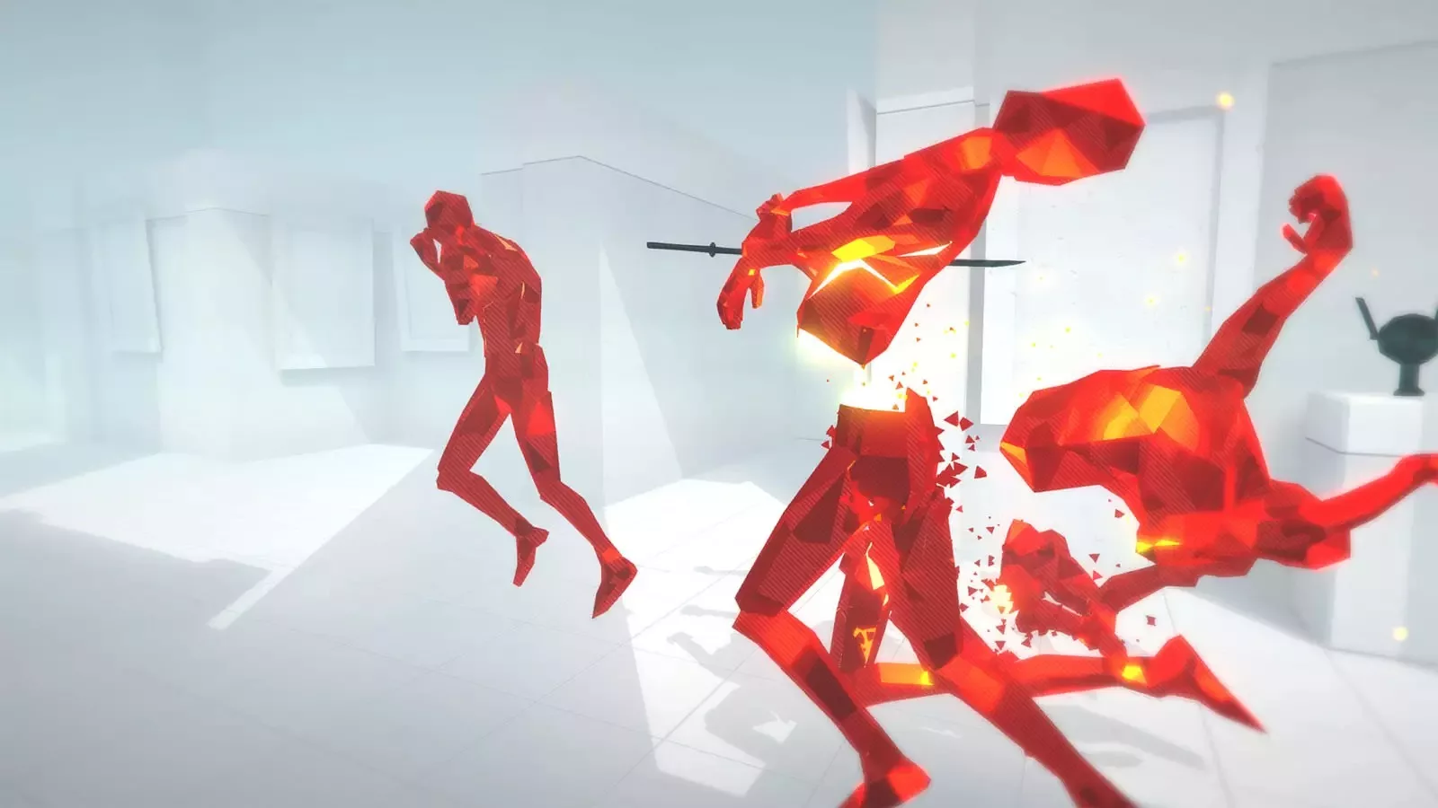 Polygonal red humanoids on a white background, with one cut in half by a sword.